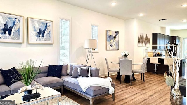 living room with light hardwood / wood-style floors