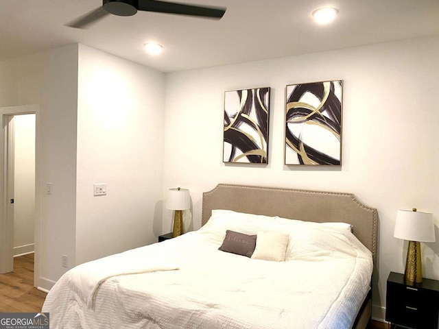 bedroom featuring hardwood / wood-style flooring and ceiling fan