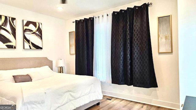 bedroom featuring hardwood / wood-style floors