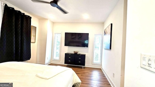 bedroom featuring dark wood-type flooring and ceiling fan