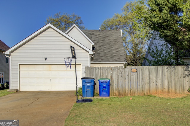 view of home's exterior with a lawn and a garage