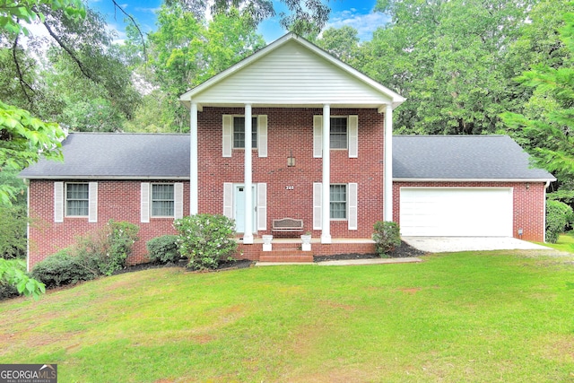 view of front of house featuring a garage and a front yard