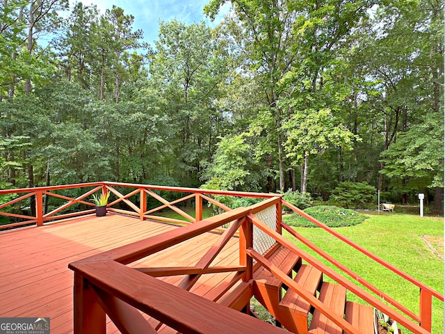 wooden deck with a yard