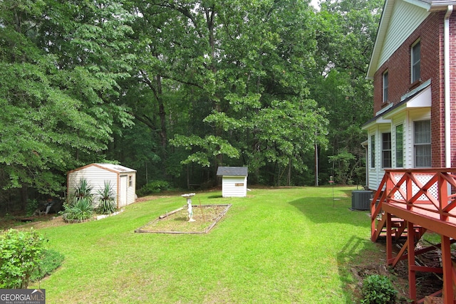 view of yard with a storage shed and cooling unit