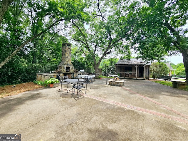 view of patio / terrace with an outdoor fire pit