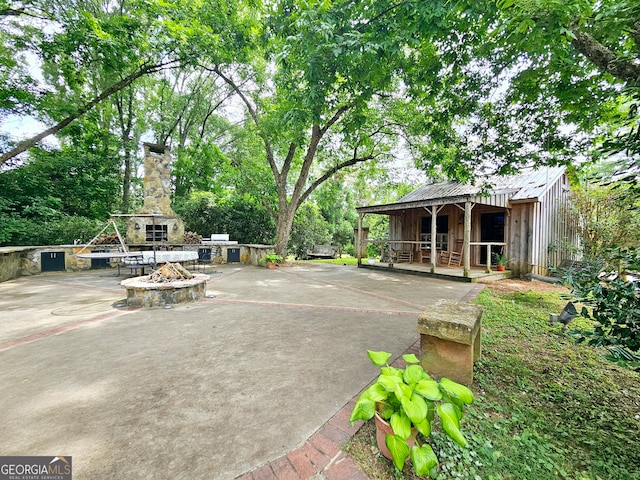 view of patio / terrace with an outdoor fire pit