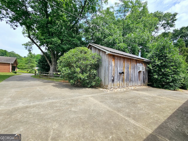 garage featuring an outdoor structure