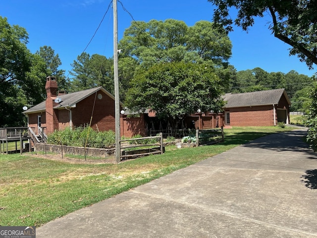 view of front of house with a garage and a front yard