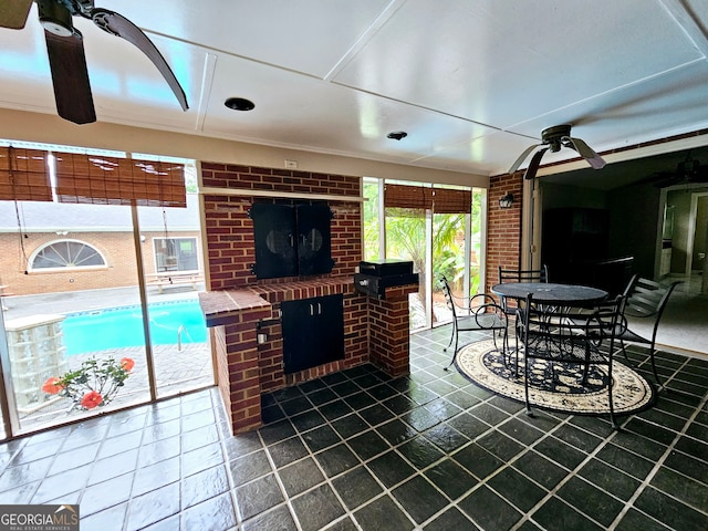 interior space with ceiling fan and an indoor pool