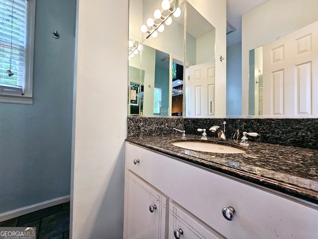 bathroom featuring tile floors and large vanity