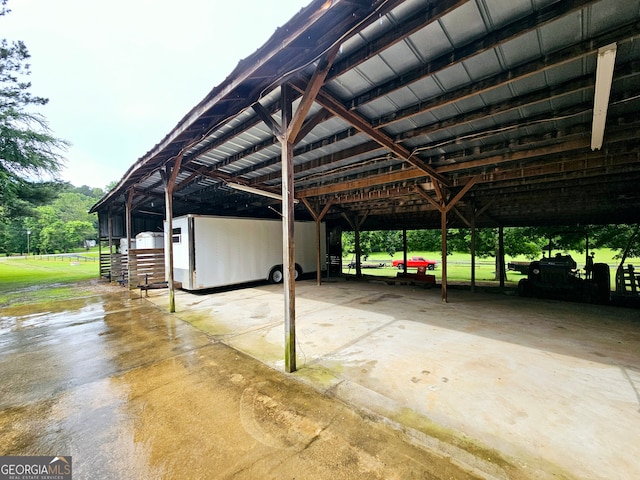 view of parking / parking lot featuring a carport