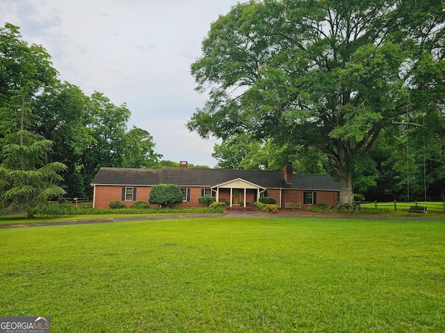 single story home with a front yard