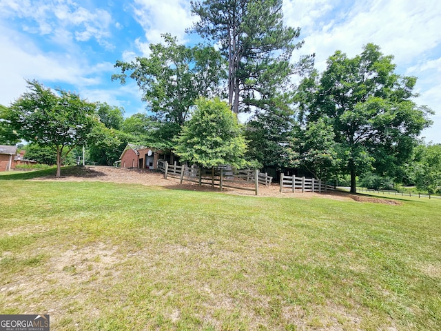 view of yard with a rural view