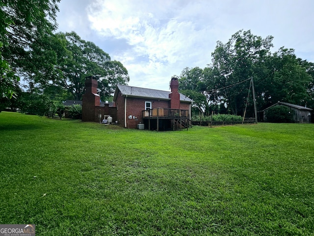 view of yard featuring a deck