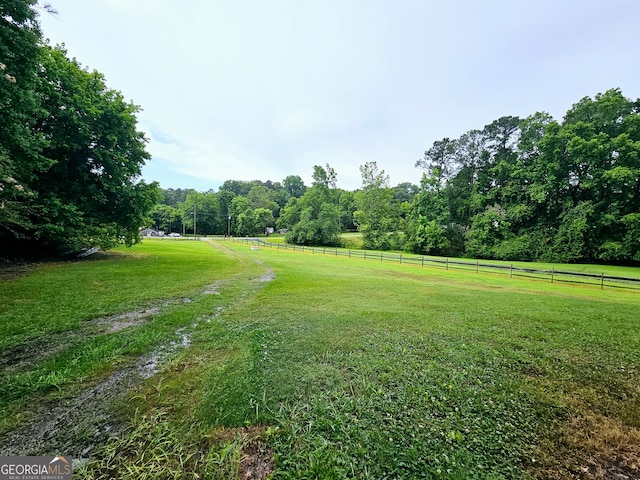 view of yard with a rural view