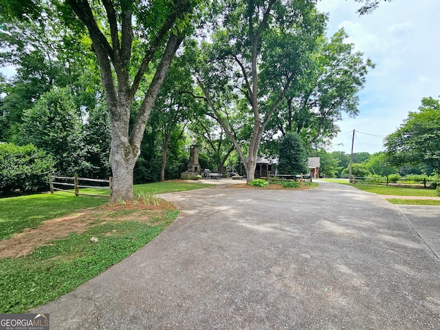 view of street with a yard