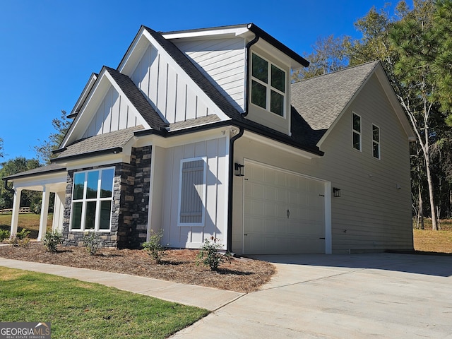 view of side of property featuring a garage