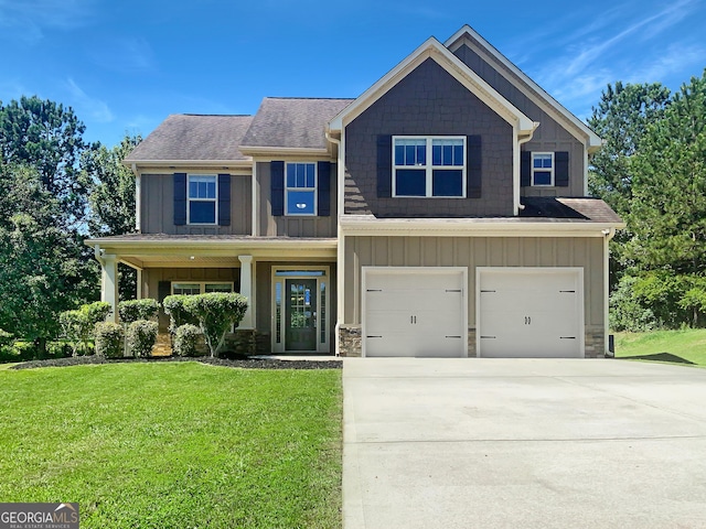 craftsman-style home with a front yard and a garage