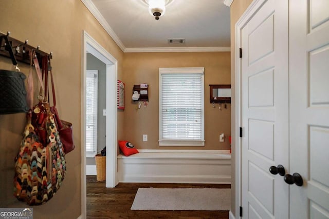 entryway featuring ornamental molding and dark wood-type flooring