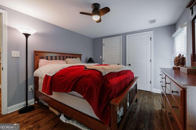 bedroom featuring dark hardwood / wood-style flooring and ceiling fan