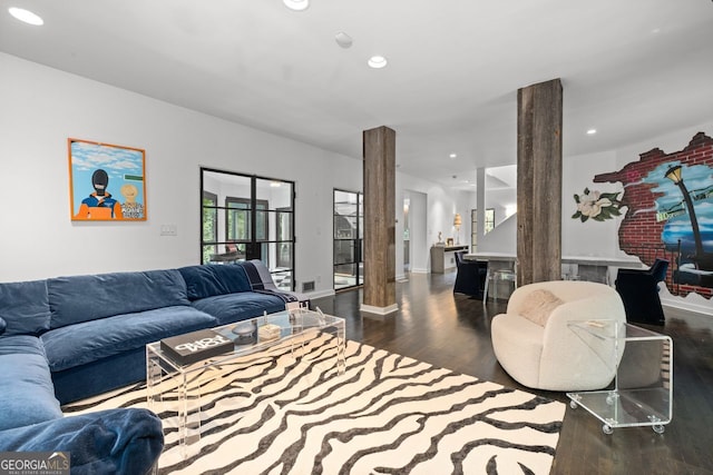 living room featuring dark wood-type flooring