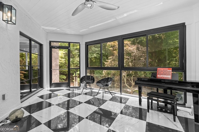 sunroom with wood ceiling and ceiling fan