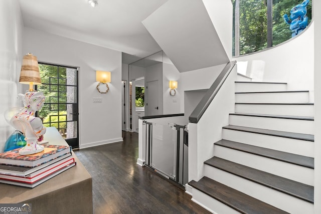 stairway featuring dark hardwood / wood-style flooring