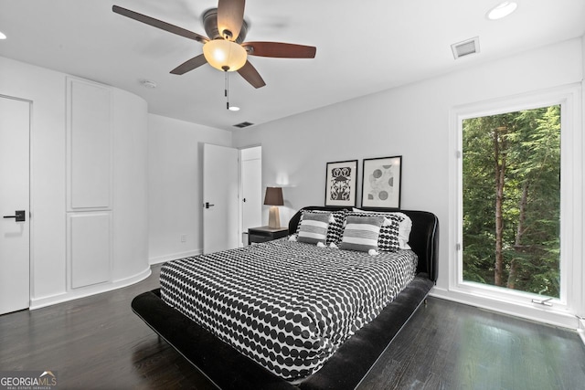 bedroom featuring dark hardwood / wood-style floors and ceiling fan