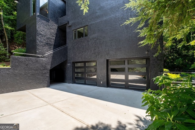 rear view of house with a garage