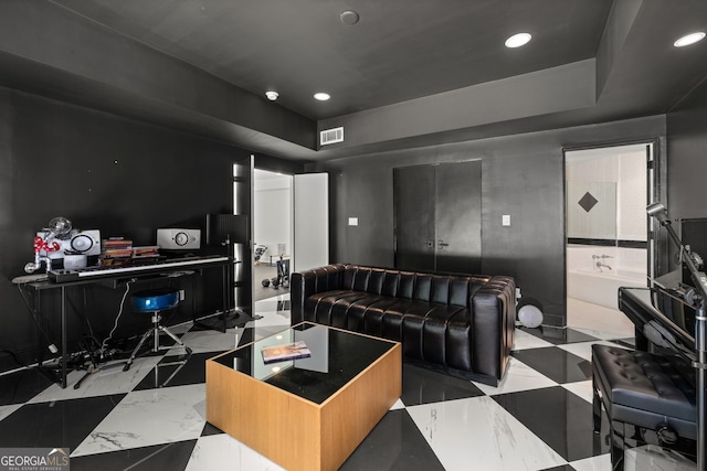 living room featuring light tile floors and a raised ceiling