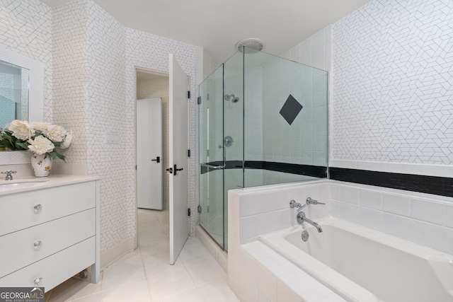 bathroom with tile flooring, separate shower and tub, and large vanity