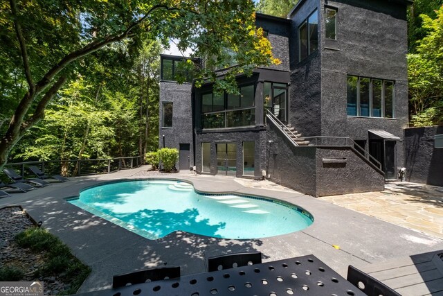 view of pool featuring a patio