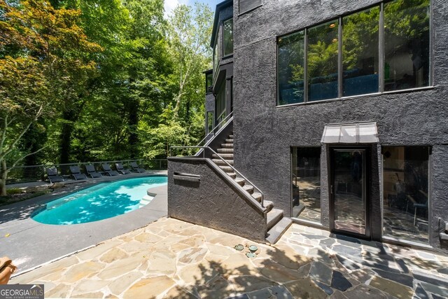 view of pool featuring a patio