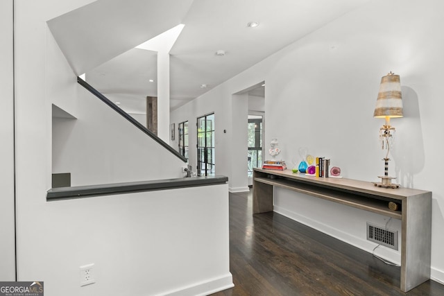 interior space with dark hardwood / wood-style floors