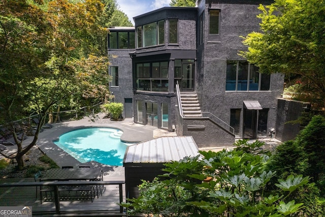 rear view of house featuring a patio