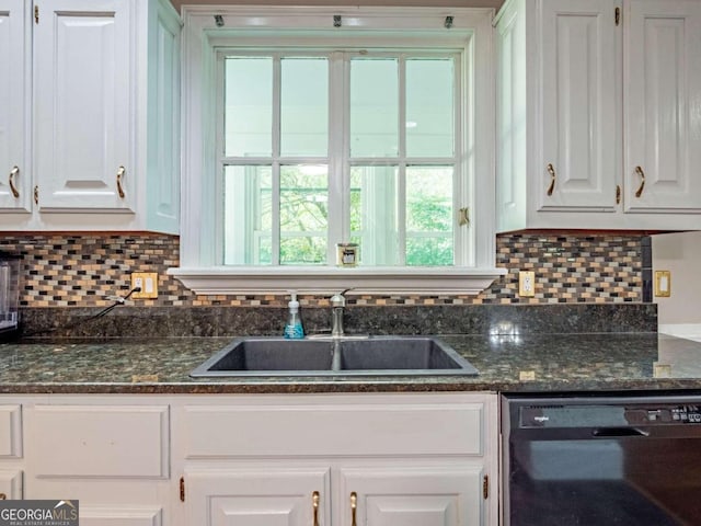 kitchen with black dishwasher, white cabinetry, dark stone counters, and sink