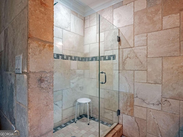 bathroom featuring an enclosed shower and ornamental molding