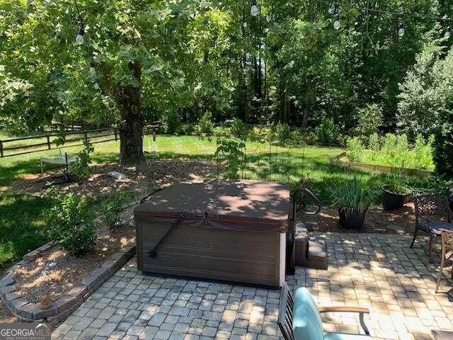 view of patio with a hot tub