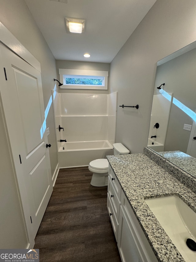 full bathroom featuring toilet, shower / bath combination, vanity, and wood-type flooring