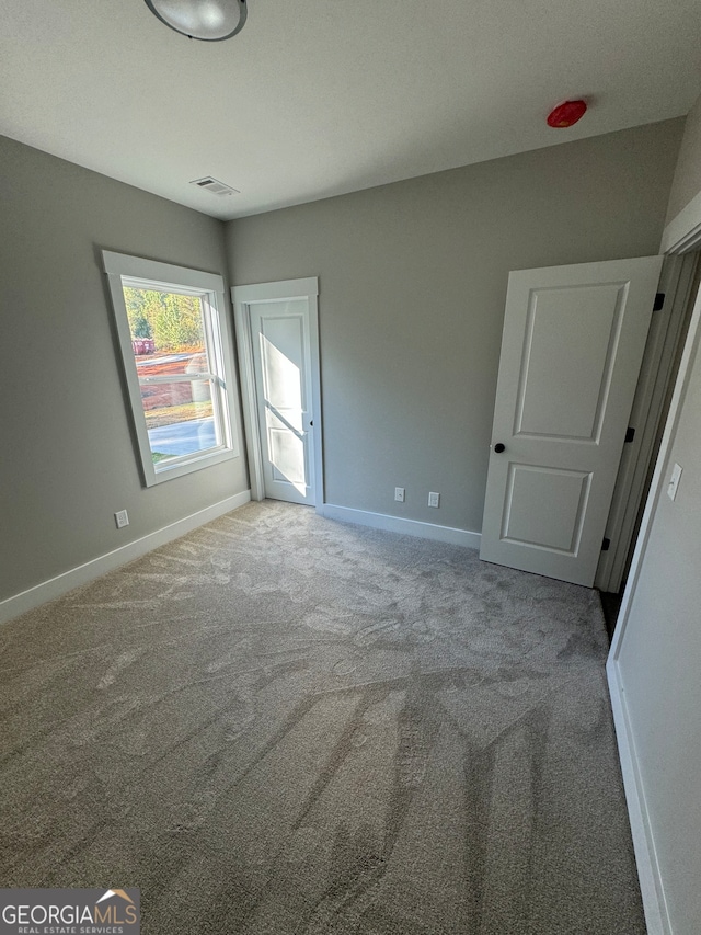 spare room with carpet flooring