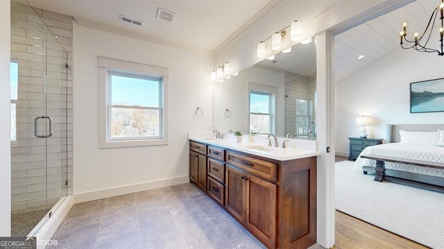 bathroom with an enclosed shower, vanity, a chandelier, and vaulted ceiling