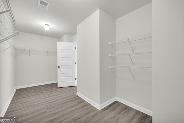1216 Trophy Club Ave, Dacula, GA 30019 - walk in closet featuring wood-type flooring