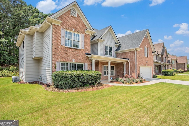 view of front of house featuring central AC, a garage, and a front lawn