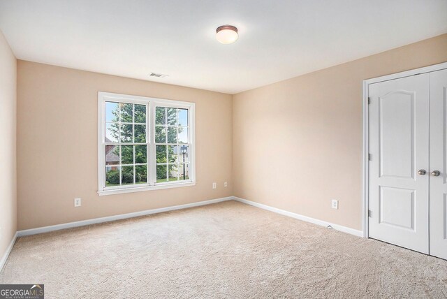 empty room with carpet flooring