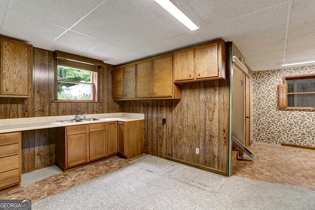 kitchen with wood walls and sink