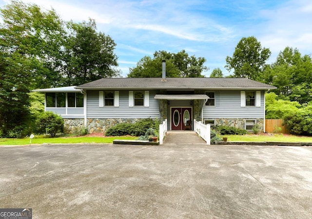 split foyer home featuring a sunroom