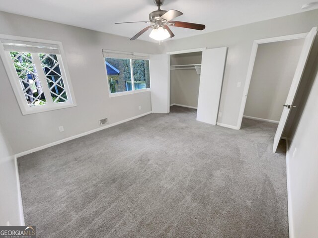 unfurnished bedroom with carpet flooring, a closet, and ceiling fan