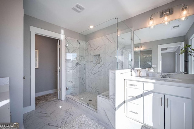 bathroom with vanity and a shower with shower door