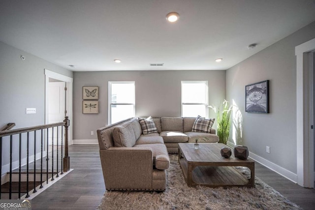 living room with dark hardwood / wood-style floors