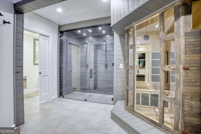 bathroom with tile patterned floors and an enclosed shower